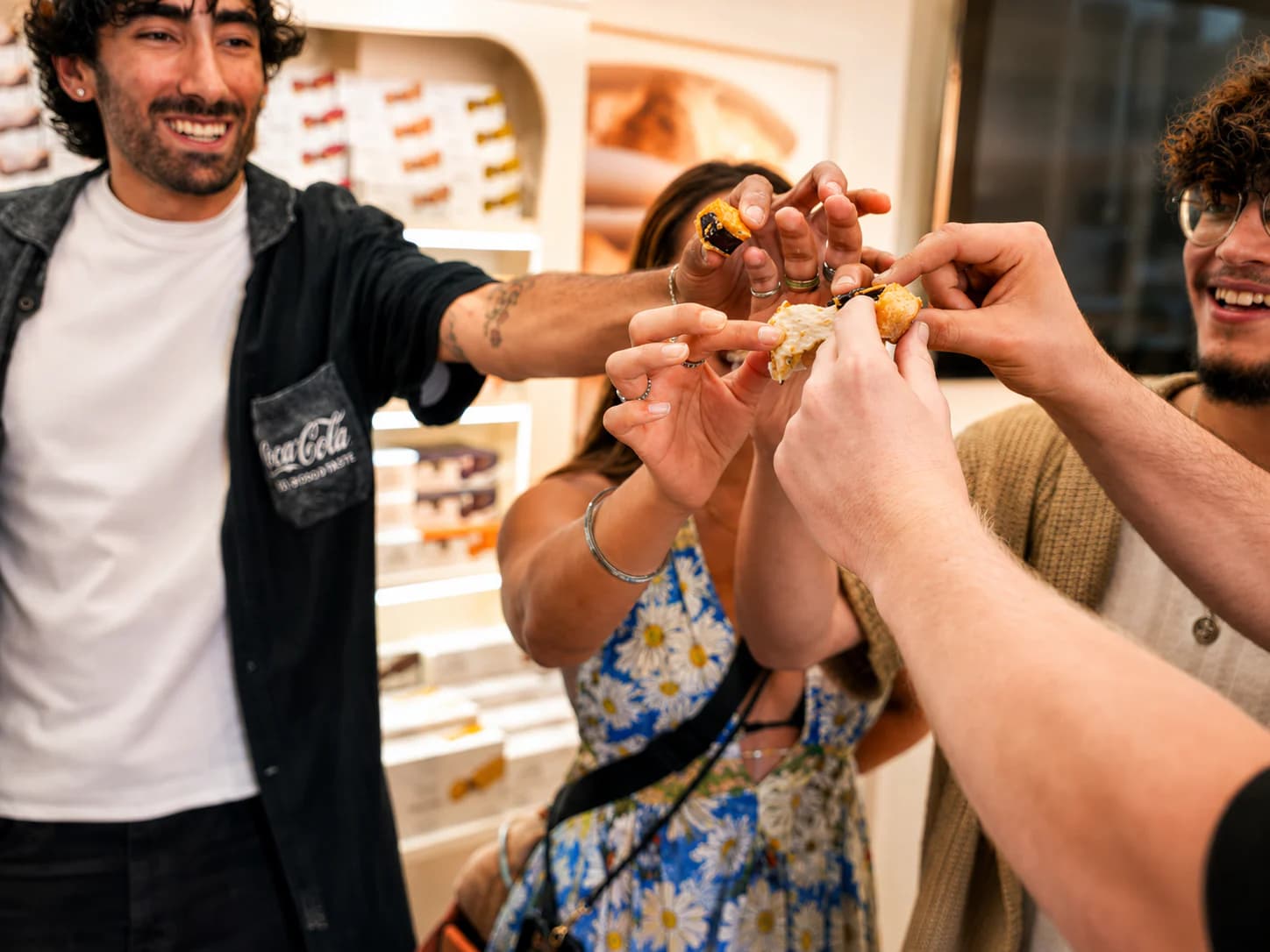 Guests reaching in to share a pintxo
