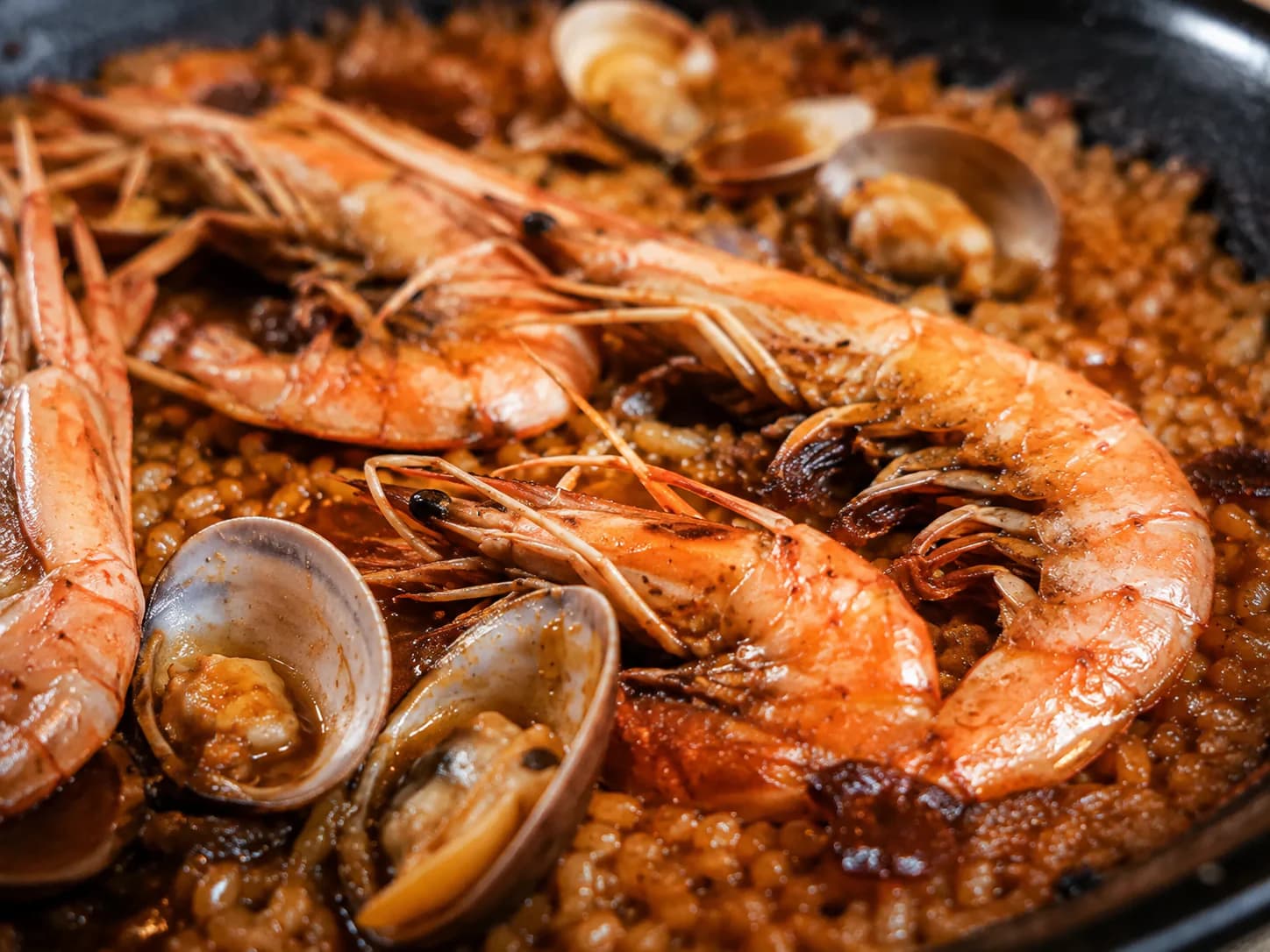 Close-up of seafood paella with prawns and shellfish