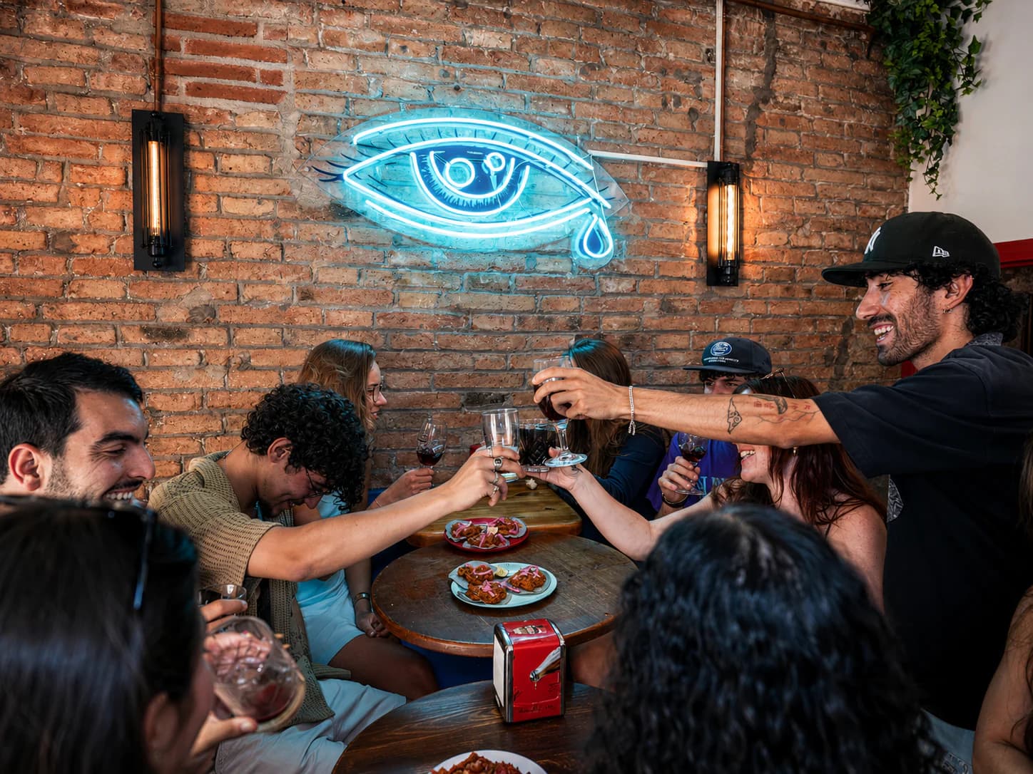 A local guide sharing a drink with guests on the Tipsy Tapas Tour